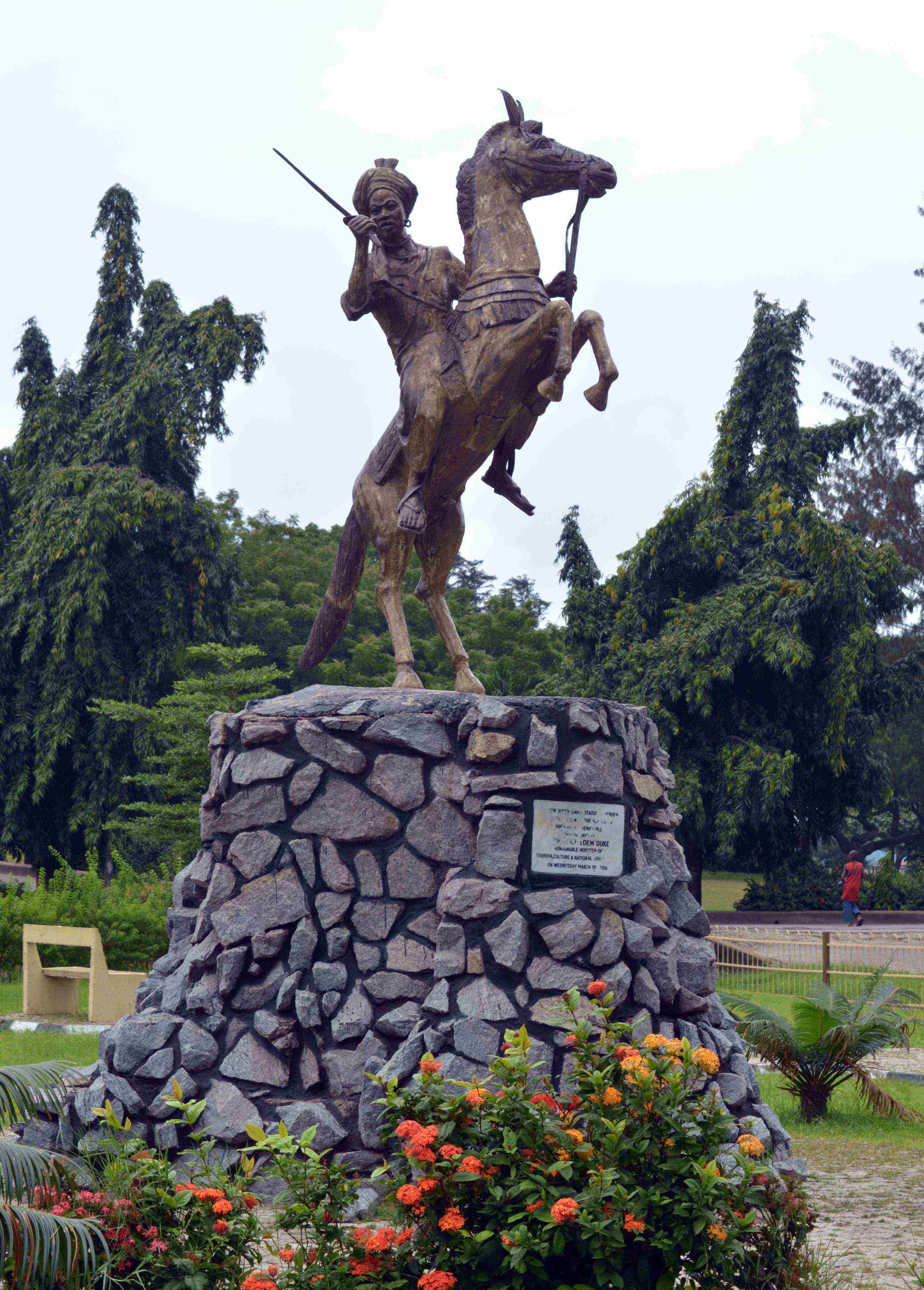A bronze equestrian statue of Queen Amina of Zazzau, holding a sword aloft, in a park in Lagos, Nigeria