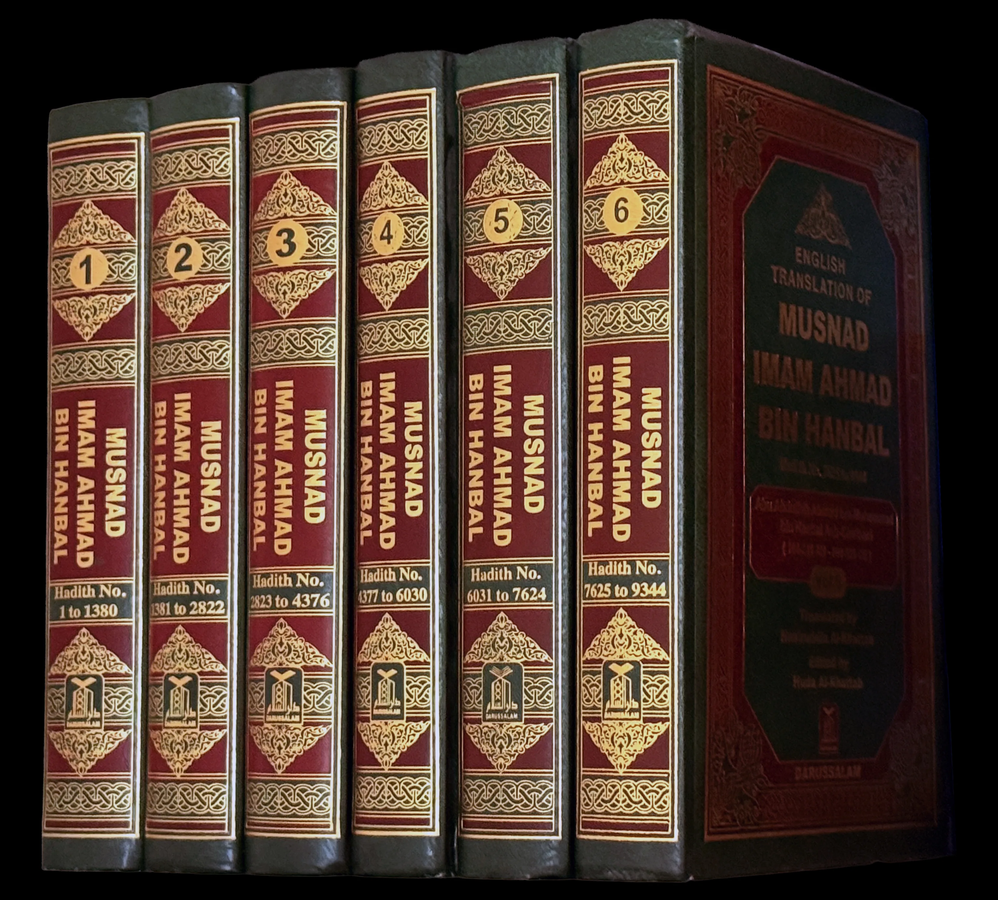 Six dark leather-bound volumes standing spine outward against a black background, numbered one to six in gold roundels, each spine tooled in gold and reading 'Musnad Imam Ahmad bin Hanbal' above a range of hadith numbers running from 1 to 9344, with the front cover of a further volume beside them lettered 'English translation of Musnad Imam Ahmad bin Hanbal'