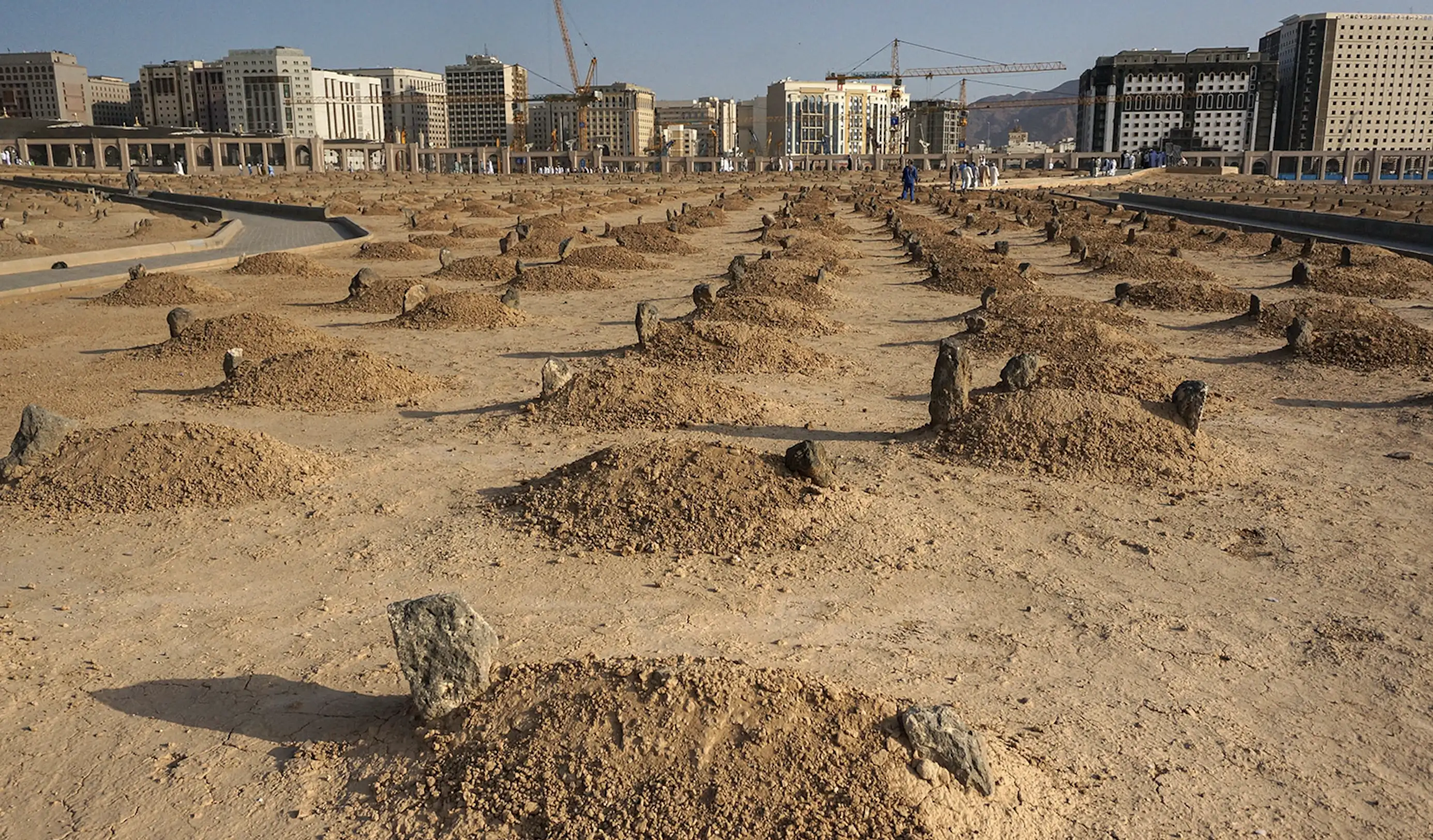 Jannat al-Baqi cemetery in Medina today, with the Prophet's Mosque and the modern city visible beyond, where Umm Habiba is buried